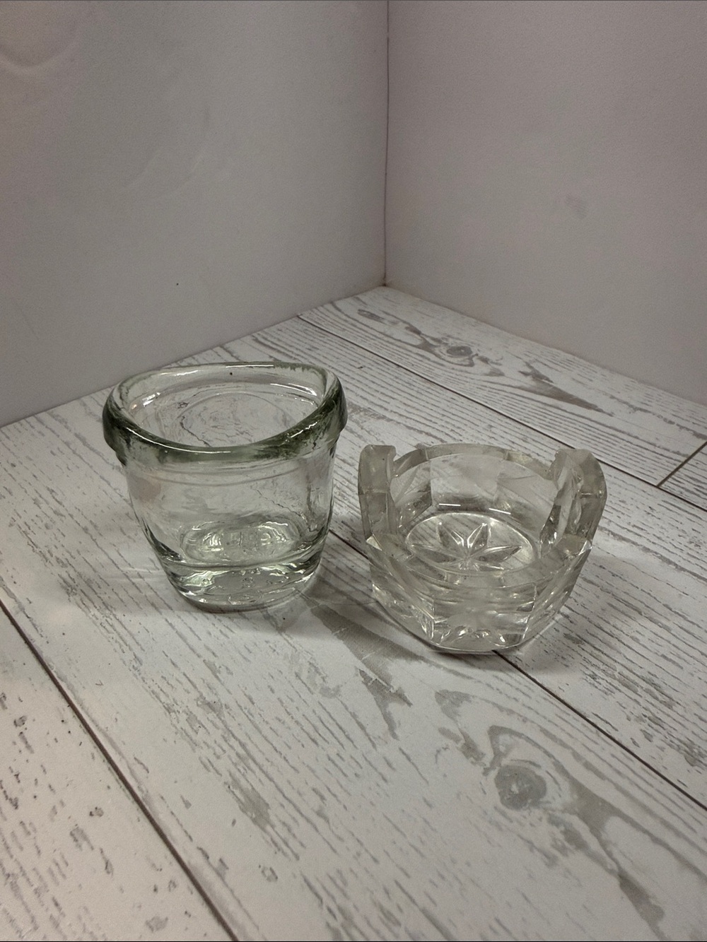 Vintage eye wash glass and a vintage salt cellar.